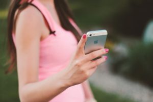 woman holding an iPhone 