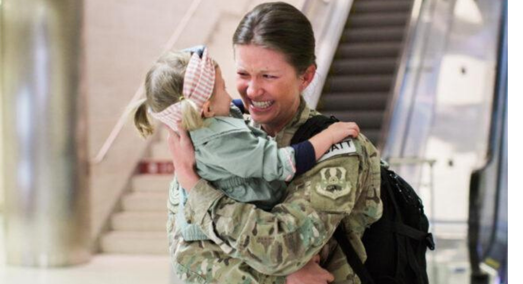 Military Mom coming home hugging daughter