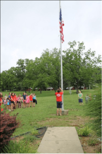 Raising the flag every morning of camp during Operation Military Support week gives military children a unique sense of pride for their country.