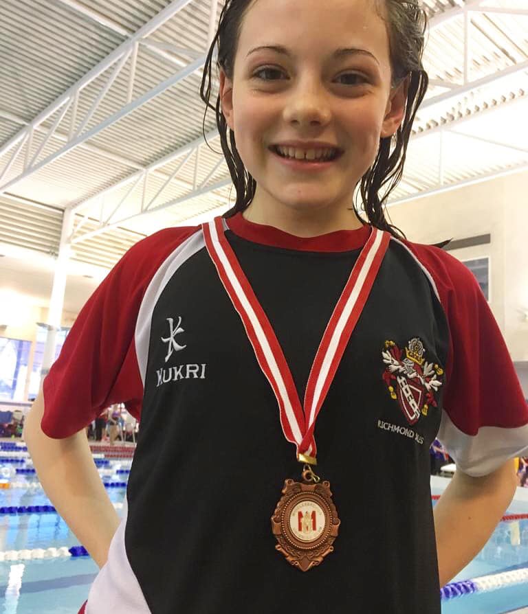 My daughter, Kathrynn, won a bronze medal in swimming.