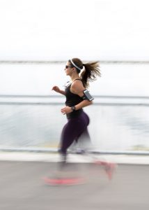 blurred image of woman running