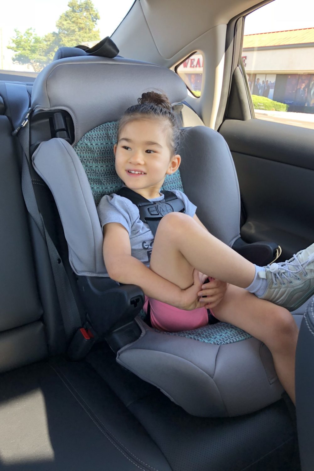 little girl in car seat