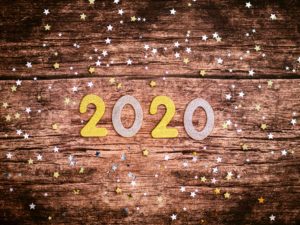 2020 new year graphic on wood with glitter