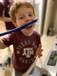 toddler enjoying food and life