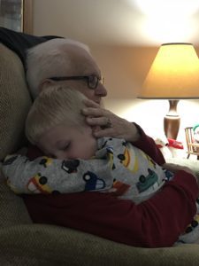 grandpa hugging child during last visit