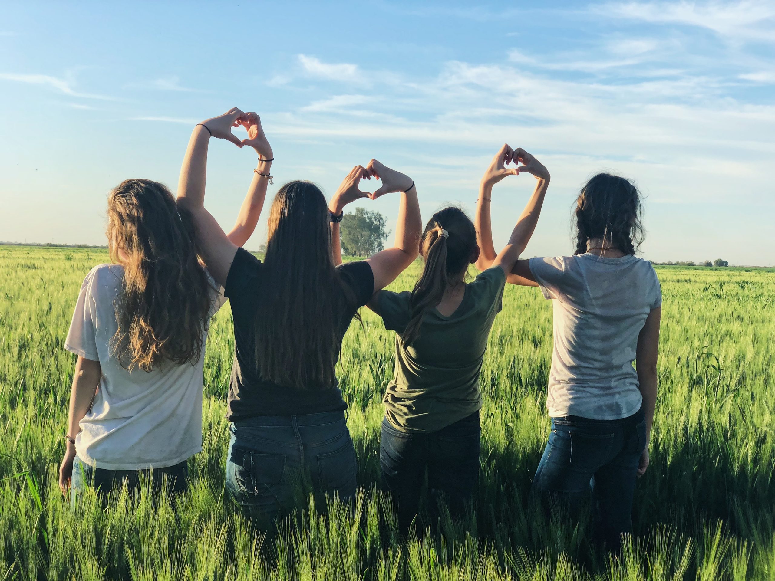 women standing together in a field