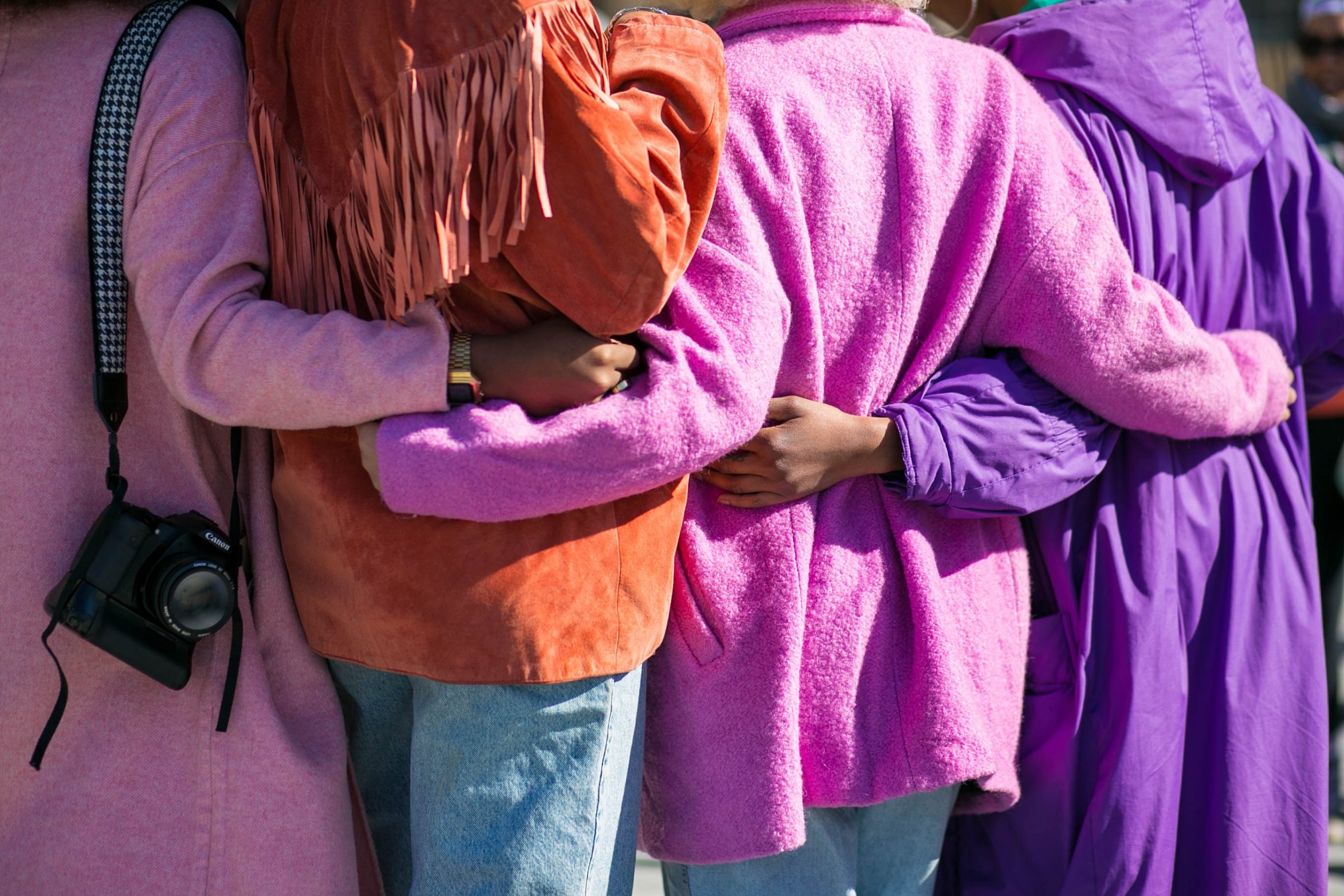 women hugging back view