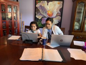 mom and daughter working from home