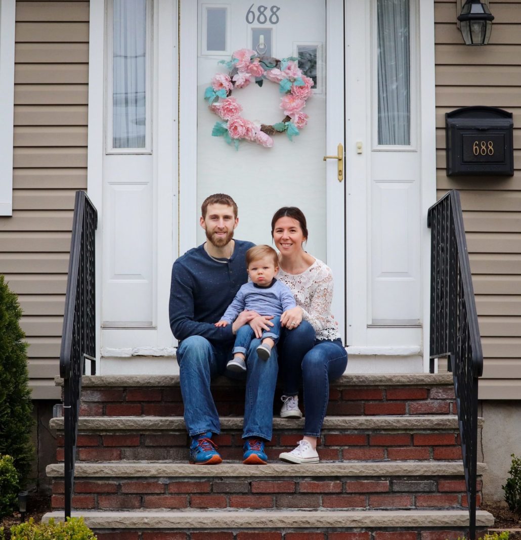 family on front porch for photo