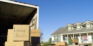 moving boxes and truck outside house