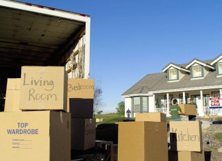 moving boxes and truck outside house