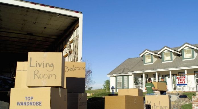 moving boxes and truck outside house