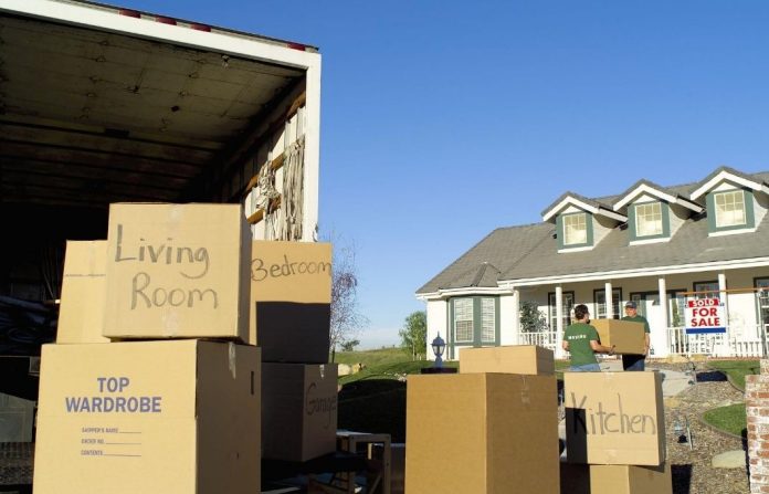 moving boxes and truck outside house