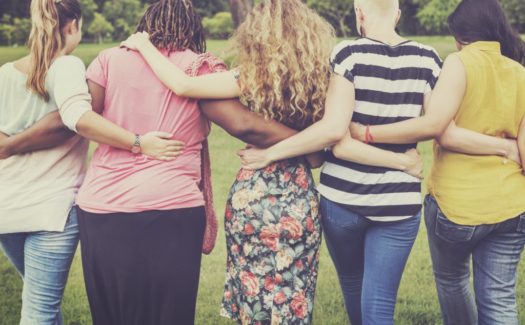 women embracing as friends