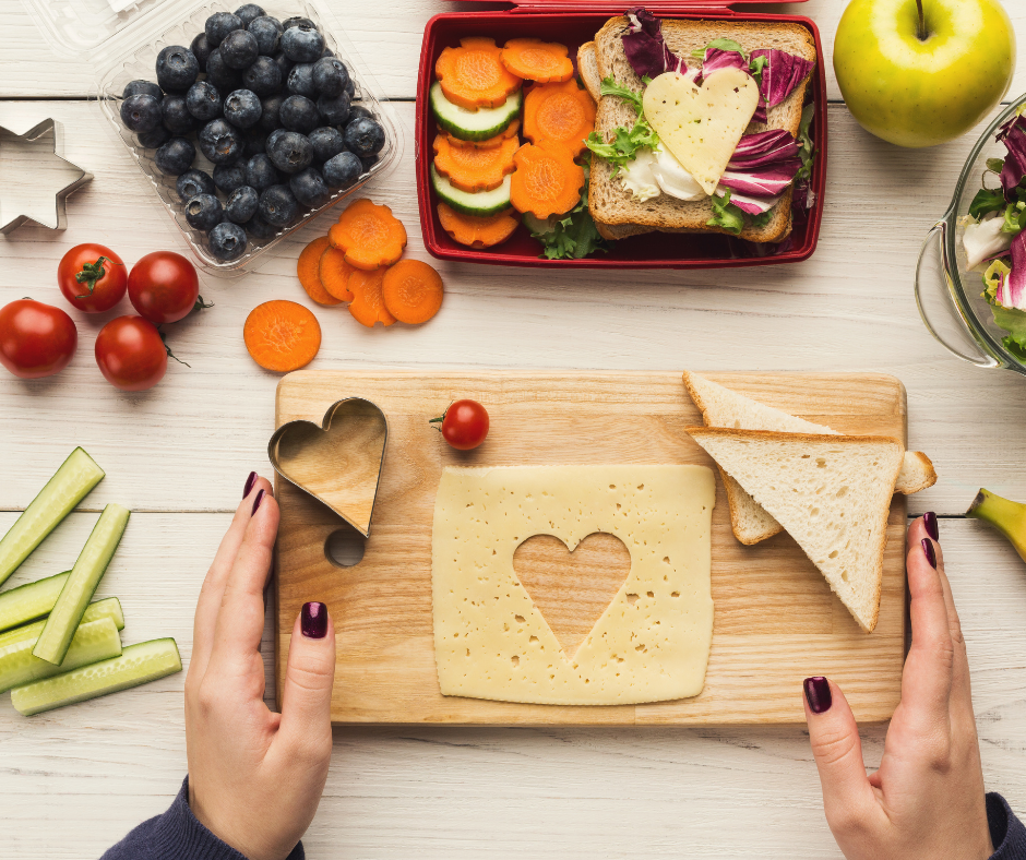 person prepping school lunch and food