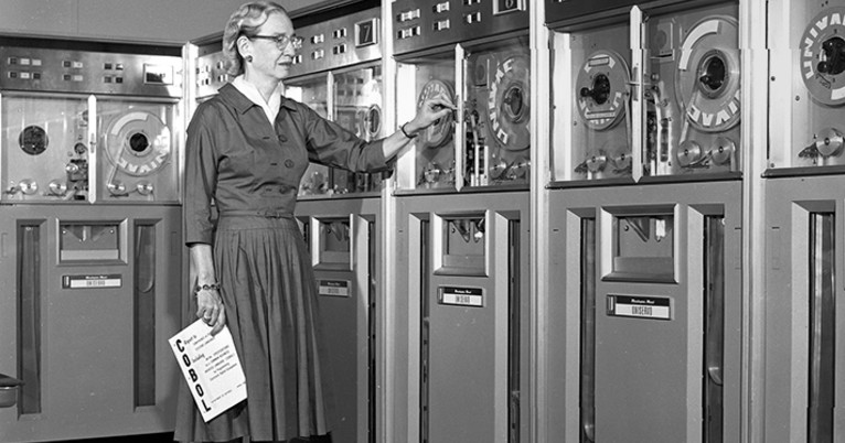 Grace Hopper in front of computer