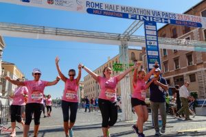 Women crossing a race finish line