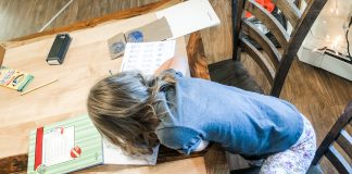 First Time Homeschooling: What’s Working and What’s Not child homeschooling with supplies