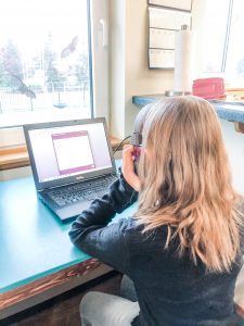 child working on computer