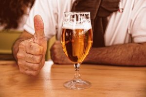 craft beer with a thumbs up