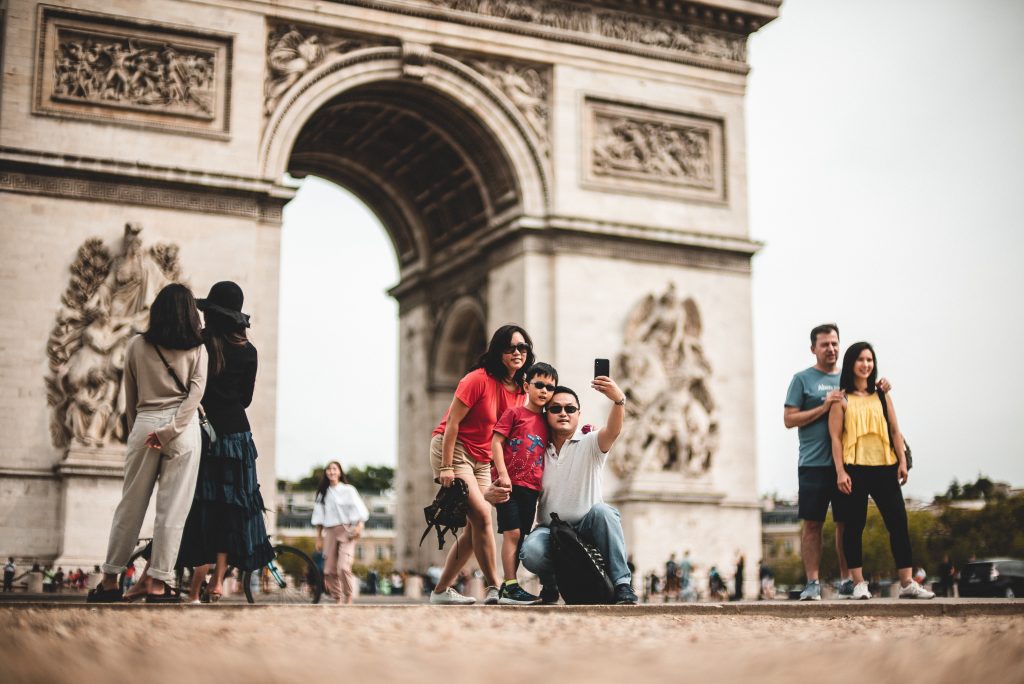 people in front of Arc de Triomphe in Paris