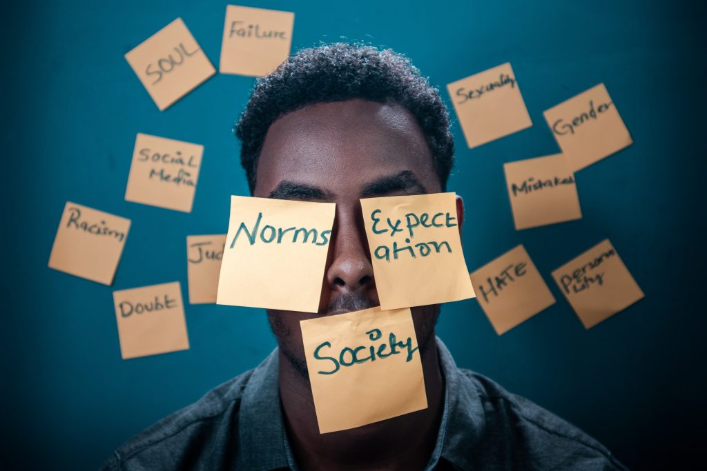 man with post-its with messages