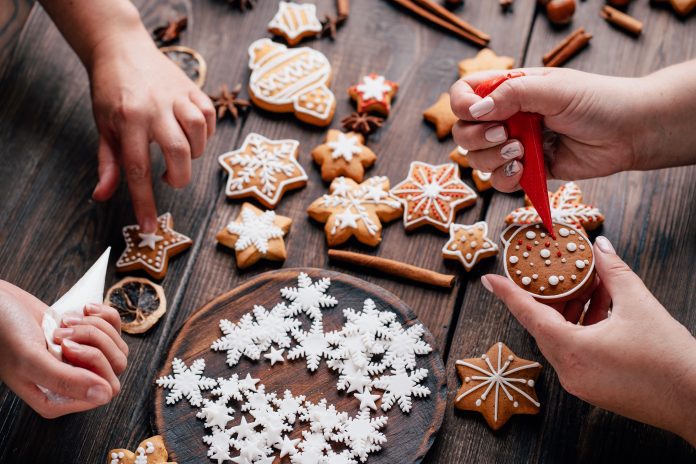 family making christmas cookies