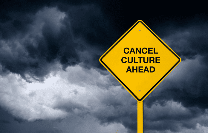 stormy background with "Cancel Culture Ahead" sign