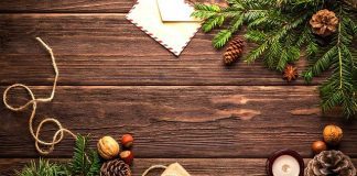 holiday tidings and presents on wood table