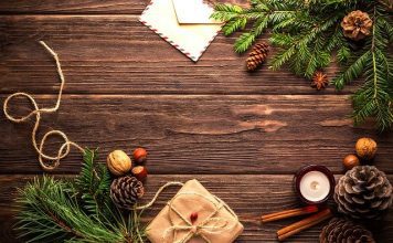 Attainable December Resolutions holiday tidings and presents on wood table