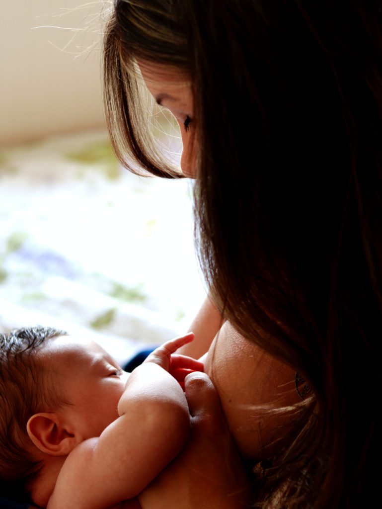 mother breastfeeding child