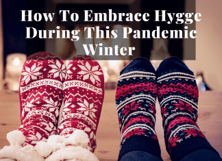 cozy socked feet by fireplace to show hygge