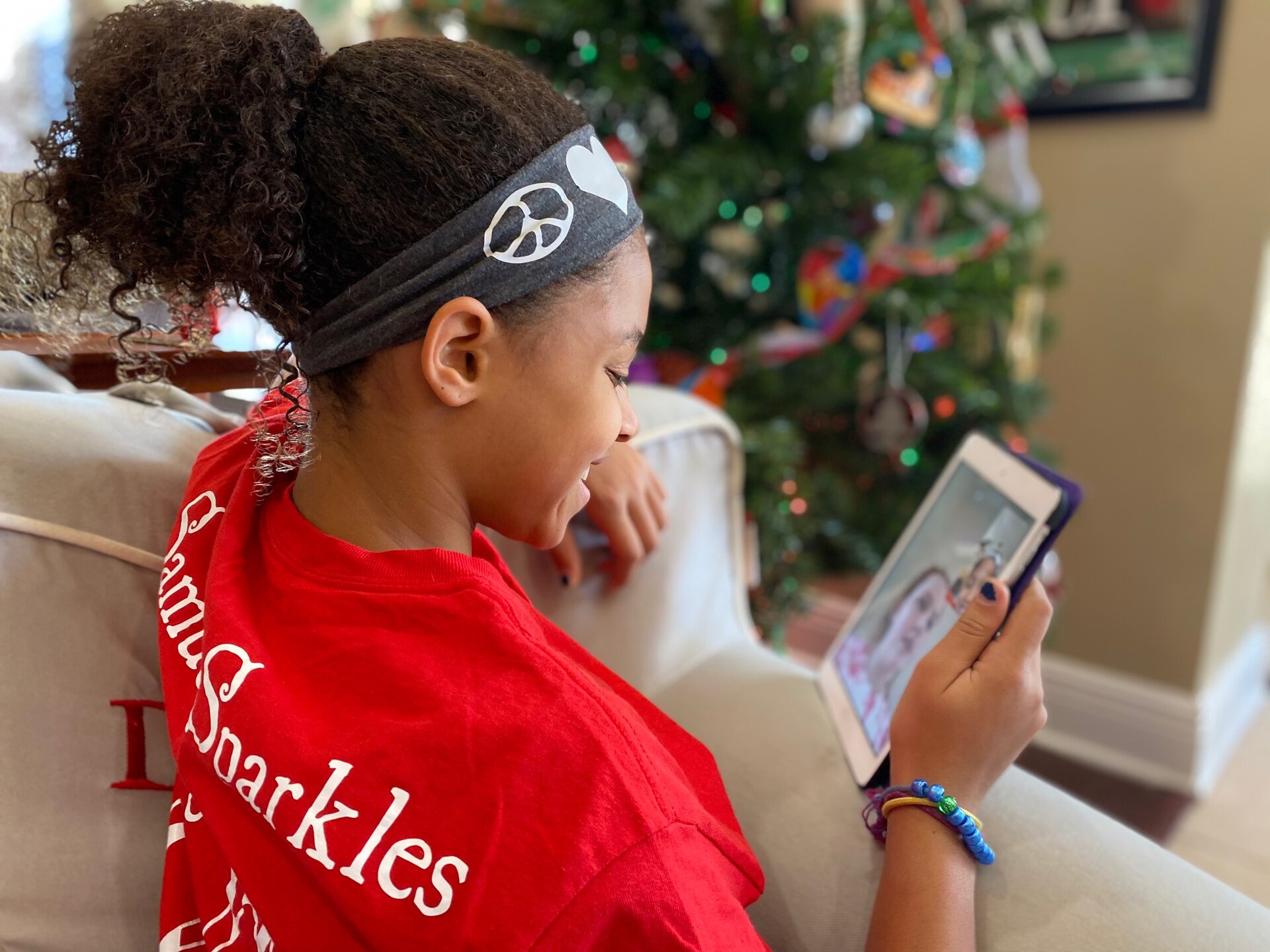 child enjoying app on tablet