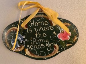 Sign that reads "Home is where the Army sends you"