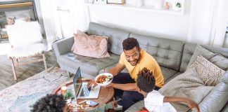 family eating on couch and coffee table