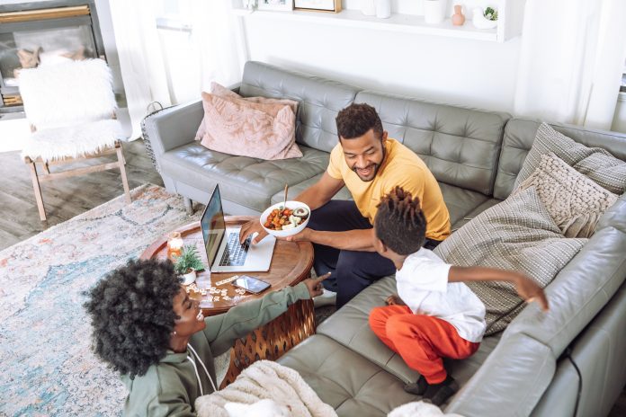 Family eating family eating on couch and coffee table