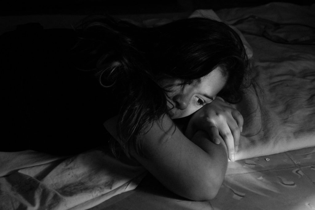 woman laying on hands in black and white