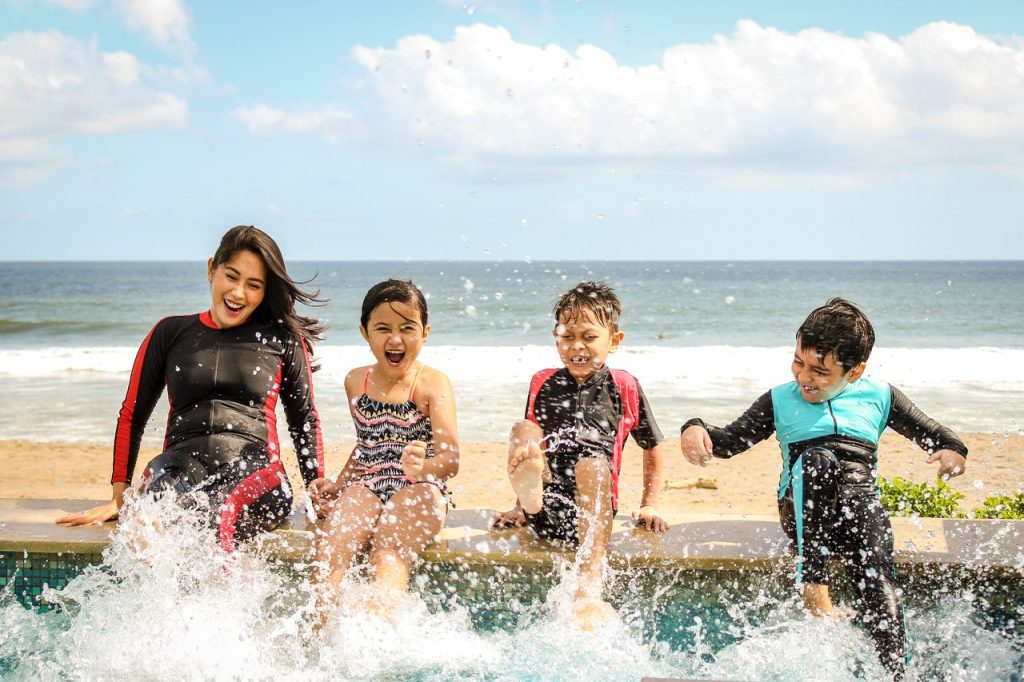 kids splashing on the beach