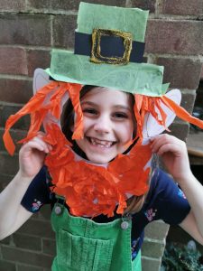 child with homemade leprechaun mask for St. Patrick's Day