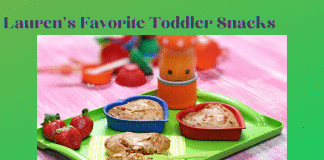 Friday Favorites – Lauren’s Favorite Toddler Snacks Lauren's Favorite Toddler Snacks with fruit and snacks on a green tray