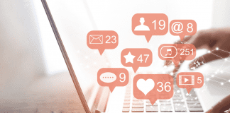 Social Media: Is It Really a Dilemma? computer open with different icons and alerts for social media