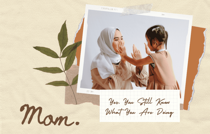 mother and child clapping hands with "mom" text on taupe background