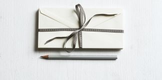 Confession: I’m a Horrible Gift Giver, But I’m Trying to be Better a gift with a bow and a pencil next to it