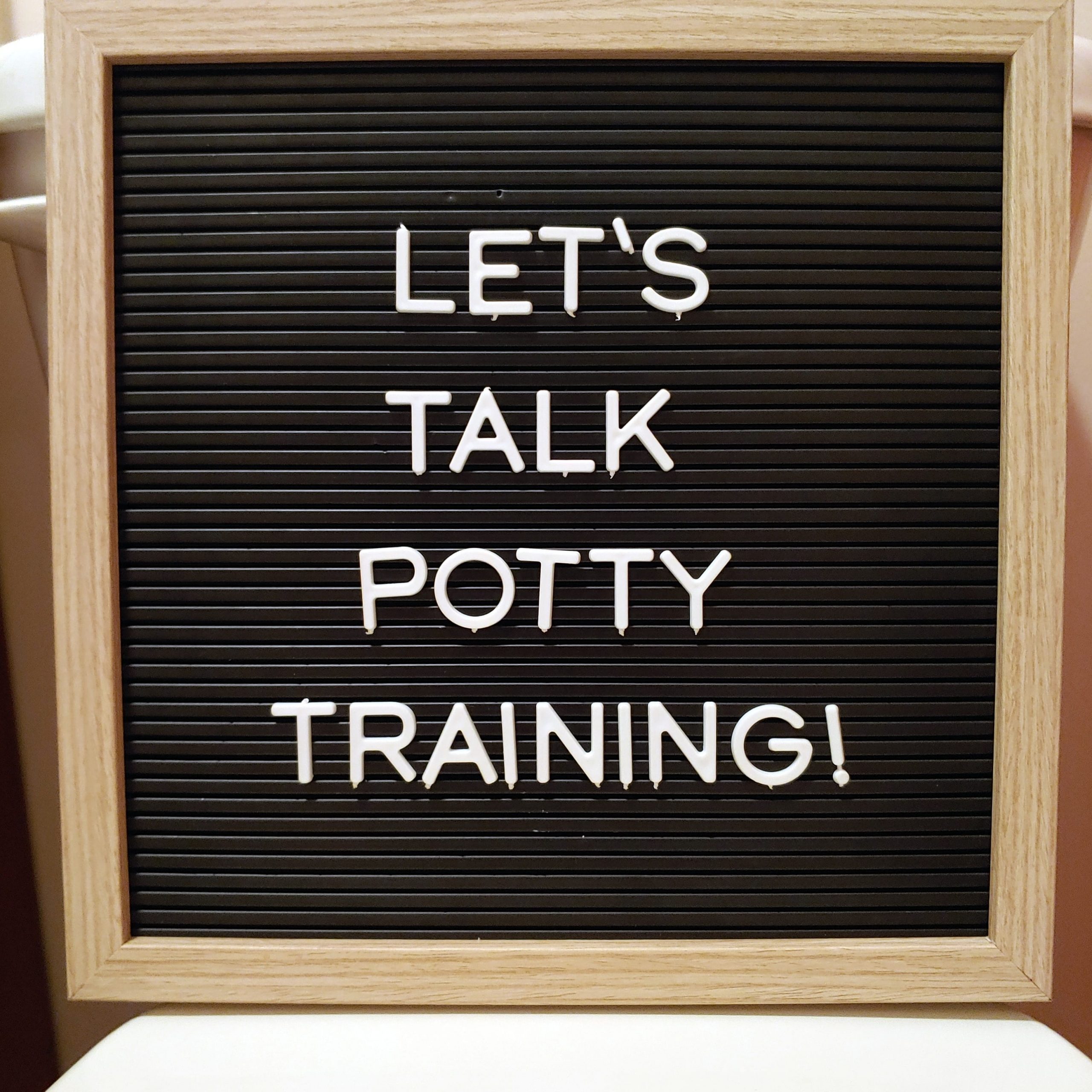 Letter board with text reading "let's talk potty training."