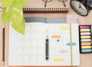 desktop with planner and notes and pens