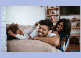 dad, mom, and child relaxing together in home