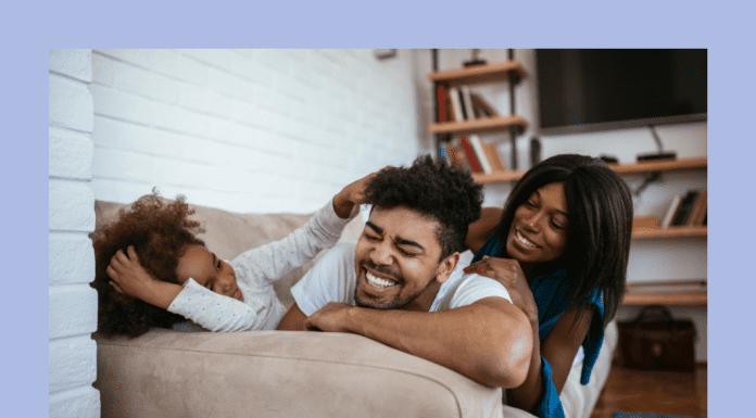 dad, mom, and child relaxing together in home