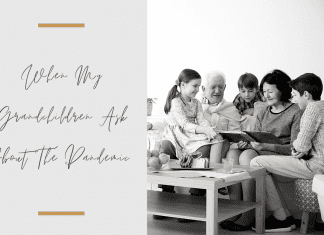 Grandparents and grandchildren sitting together in a black and white photo