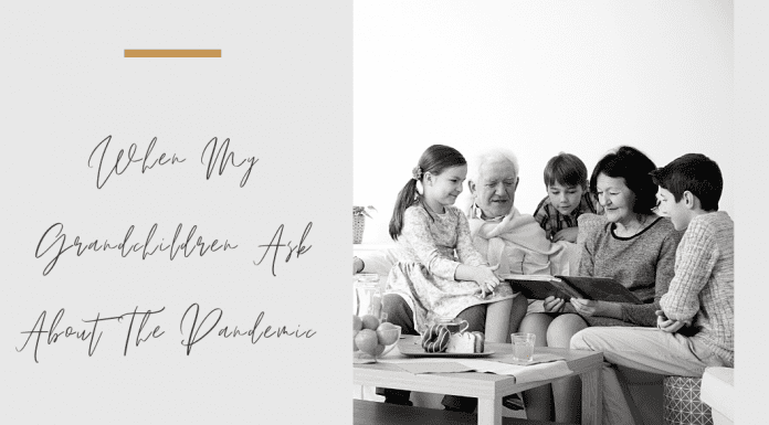 Grandparents and grandchildren sitting together in a black and white photo