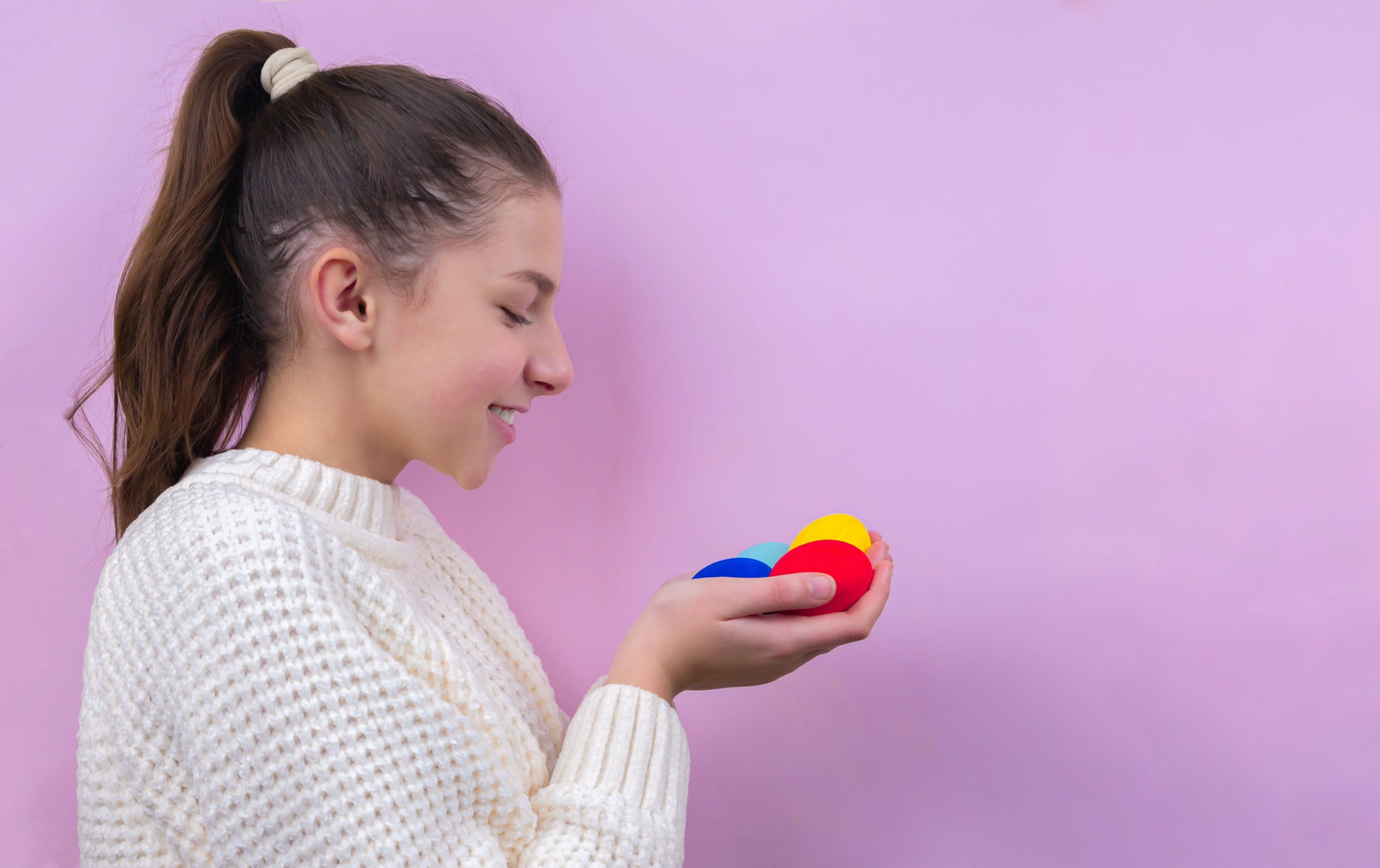 girl holding easter eggs